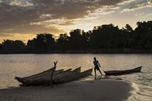 Madagascar, Beopaka, Pirogues at dusk on Manambolo river