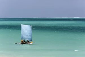 Madagascar, Salary, A pirogue sailing in the blue sea