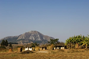 Malawi, Dedza. Grass-roofed houses in a rural village in the Dedza region Malawi, Dedza. Grass-roofed houses in a rural village in the Dedza region