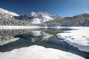 Malenco valley, reflected on the Palu lake after autumn snowy, Lombardy, Italy Malenco valley, reflected on the Palu lake after autumn snowy, Lombardy, Italy