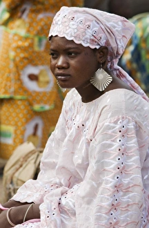 Mali, DjennA Peul woman wearing large earrings at Djennarket Mali, DjennA Peul woman wearing large earrings at Djennarket