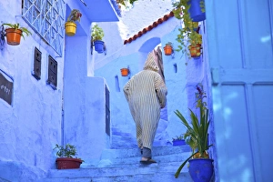 Man In Robe, Chefchaouen, Morocco, North Africa Man In Robe, Chefchaouen, Morocco, North Africa