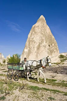 Man using traditional transport, Tufa rock formations, Rose Valley, nr Goreme, Cappadocia Man using traditional transport, Tufa rock formations, Rose Valley, nr Goreme, Cappadocia