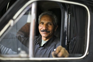 A mechanic sits inside a car at his garage in the district of Zamalek A mechanic sits inside a car at his garage in the district of Zamalek