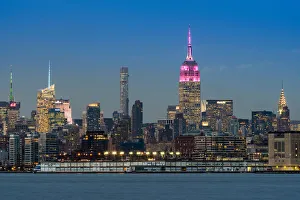 Midtown skyline at dusk with the Empire State Building in pink and white colors, Manhattan Midtown skyline at dusk with the Empire State Building in pink and white colors, Manhattan