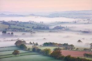 Mist covered countryside at dawn near Pennorth, Brecon Beacons National Park, Powys, Wales Mist covered countryside at dawn near Pennorth, Brecon Beacons National Park, Powys, Wales