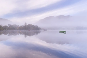 Misty autumn morning on Ullswater in the Lake District, Cumbria, England. Autumn Misty autumn morning on Ullswater in the Lake District, Cumbria, England. Autumn