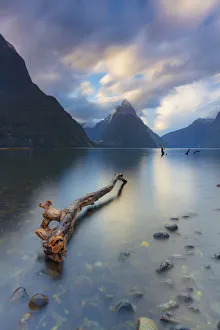 Mitre Peak reflecting in the fjord water at sunset at Milford Sound in New Zealand Mitre Peak reflecting in the fjord water at sunset at Milford Sound in New Zealand