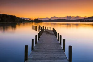 Monk Jetty at Sunset, Coniston Water, Lake District National Park, Cumbria, England Monk Jetty at Sunset, Coniston Water, Lake District National Park, Cumbria, England