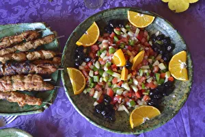 Moroccan salad and brochettes. Erg Chigaga sand dunes, Sahara desert. Morocco Moroccan salad and brochettes. Erg Chigaga sand dunes, Sahara desert. Morocco