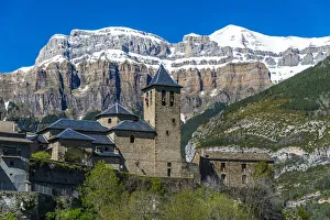 The mountain village of Torla with the snowy Pyrenees behind, Huesca, Aragon, Spain The mountain village of Torla with the snowy Pyrenees behind, Huesca, Aragon, Spain