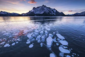 Mt. Michener & Frozen Bubbles in Abraham Lake at Sunrise, Kootenay Plains, Alberta Mt. Michener & Frozen Bubbles in Abraham Lake at Sunrise, Kootenay Plains, Alberta