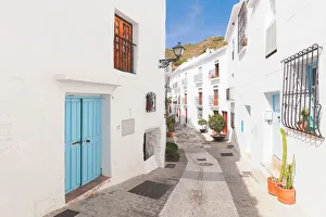 A narrow alley in Frigiliana, La Axarquia, Malaga province, Andalusia, Spain A narrow alley in Frigiliana, La Axarquia, Malaga province, Andalusia, Spain