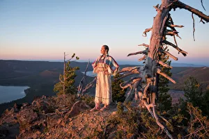 Native woman, Acosia M. Red Elk, in historic buckskin dress on top of Paulina Peak