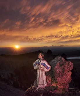 Native woman, Acosia M. Red Elk, in historic buckskin dress on top of Paulina Peak
