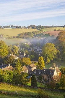 Naunton village and morning mist, Naunton, Gloucestershire, Cotswolds, UK Naunton village and morning mist, Naunton, Gloucestershire, Cotswolds, UK