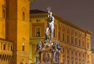 Neptune sculpture in the old town of Bologna at twilight Neptune sculpture in the old town of Bologna at twilight