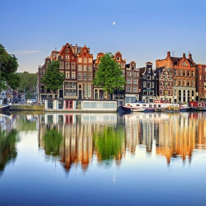 Images Dated 17th April 2015: Netherlands, North Holland, Amsterdam. Typical houses and houseboats on Amstel river