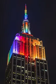 Night low angle view of the Empire State Building with rainbow colors, Manhattan Night low angle view of the Empire State Building with rainbow colors, Manhattan