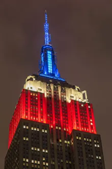 Night view of the Empire State Building with red, white and blue colors in honor of Night view of the Empire State Building with red, white and blue colors in honor of