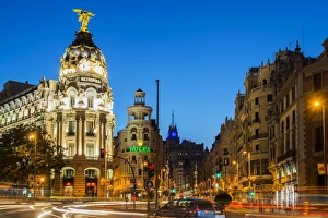 Night view of Gran Via street and Metropolis Building with car light trails, Madrid Night view of Gran Via street and Metropolis Building with car light trails, Madrid