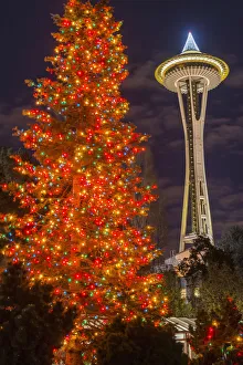 Night view of Space Needle and Christmas tree at Seattle Center, Seattle, Washington, USA Night view of Space Needle and Christmas tree at Seattle Center, Seattle, Washington, USA