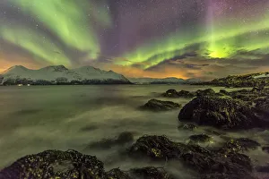 Northern Lights on the icy landscape of Svensby Lyngen Alps Northern Lights on the icy landscape of Svensby Lyngen Alps