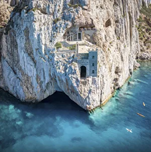 Old mining area in the rock above the turquoise sea in Sardinia, Italy. Porto Flavia Old mining area in the rock above the turquoise sea in Sardinia, Italy. Porto Flavia