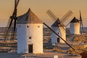 Old Spanish windmills at sunrise, Consuegra, Castilla-La Mancha, Spain Old Spanish windmills at sunrise, Consuegra, Castilla-La Mancha, Spain