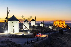 Old Spanish windmills at sunset, Consuegra, Castilla-La Mancha, Spain Old Spanish windmills at sunset, Consuegra, Castilla-La Mancha, Spain