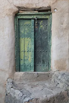 Oman, Ad Dakhiliyah region, Al Hamra, Misfat Al Abreen, Old green, wooden door in Oman, Ad Dakhiliyah region, Al Hamra, Misfat Al Abreen, Old green, wooden door in
