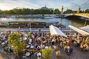 Outdoor cafe/restaurant by the River Seine & Pont Alexandre III, Paris, France Outdoor cafe/restaurant by the River Seine & Pont Alexandre III, Paris, France