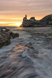 overview of San Pietro Church at sunset in summer time, Porto Venere, La Spezia province overview of San Pietro Church at sunset in summer time, Porto Venere, La Spezia province