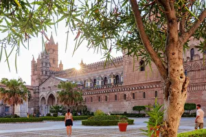 Palermo, Sicily. Tourists visiting the baroque Cathedral at sunset Palermo, Sicily. Tourists visiting the baroque Cathedral at sunset