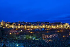 Panoramic night view of the medieval city walls illuminated, Avila, Castile and LeAA³n Panoramic night view of the medieval city walls illuminated, Avila, Castile and LeAA³n
