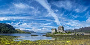 Panoramic view of Eilean Donan Castle by Loch Duich against blue sky, Dornie, Kyle Panoramic view of Eilean Donan Castle by Loch Duich against blue sky, Dornie, Kyle