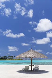 Luxury Resort Gallery: Parasol and sunloungers at Olhuveli Beach and Spa Resort, South Male Atoll, Kaafu Atoll