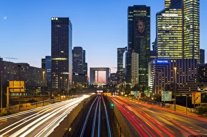 Paris road leading towards La Grand Arche and modern office buildings at La Defense Paris road leading towards La Grand Arche and modern office buildings at La Defense