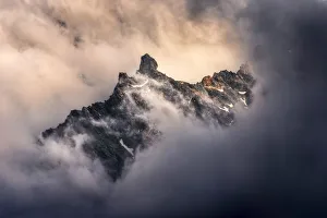 Peaks of the Alps appearing during a storm clearing, Alps, France Peaks of the Alps appearing during a storm clearing, Alps, France