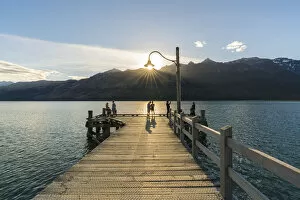 Glenorchy Gallery: People on the jetty on Lake Wakatipu just before sunset