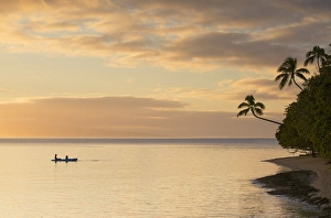 People kayaking at sunset, Leleuvia Island, Lomaiviti Islands, Fiji People kayaking at sunset, Leleuvia Island, Lomaiviti Islands, Fiji