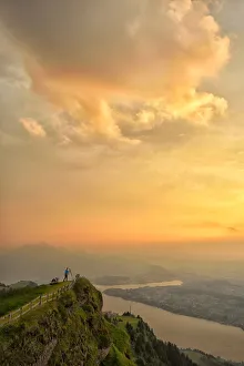 Photographer at sunset over lake Zug, On top of Mount Rigi, Switzerland, North-Eastern Photographer at sunset over lake Zug, On top of Mount Rigi, Switzerland, North-Eastern