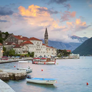 The picturesque coastal village of Perast illuminated at sunset, Perast, Bay of Kotorska The picturesque coastal village of Perast illuminated at sunset, Perast, Bay of Kotorska