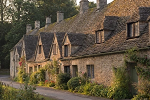 Picturesque cottages at Arlington Row in the Cotswolds village of Bibury, Gloucestershire Picturesque cottages at Arlington Row in the Cotswolds village of Bibury, Gloucestershire
