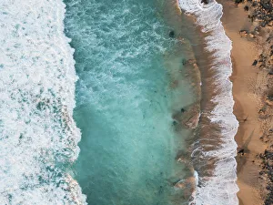Playa del Aguila, El Cotillo, Fuerteventura. Aerial view directly above waves Playa del Aguila, El Cotillo, Fuerteventura. Aerial view directly above waves