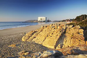 Plettenberg Bay beach at dawn with Beacon Island Hotel in background, Western Cape Plettenberg Bay beach at dawn with Beacon Island Hotel in background, Western Cape