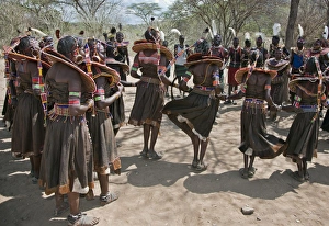 Pokot men and women dancing to celebrate an Atelo ceremony. The Pokot are pastoralists speaking a Southern Pokot men and women dancing to celebrate an Atelo ceremony. The Pokot are pastoralists speaking a Southern