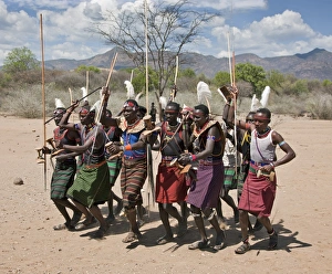 Pokot warriors celebrate an Atelo ceremony. The Pokot are pastoralists speaking a Southern Nilotic language Pokot warriors celebrate an Atelo ceremony. The Pokot are pastoralists speaking a Southern Nilotic language