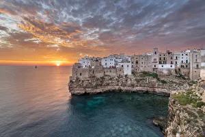 Polignano a Mare during a summer sunrise (province of Bari, Apulia, Italy) Polignano a Mare during a summer sunrise (province of Bari, Apulia, Italy)
