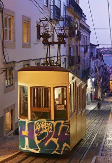 Portugal, Lisbon, Alfama district, Tram at dusk
